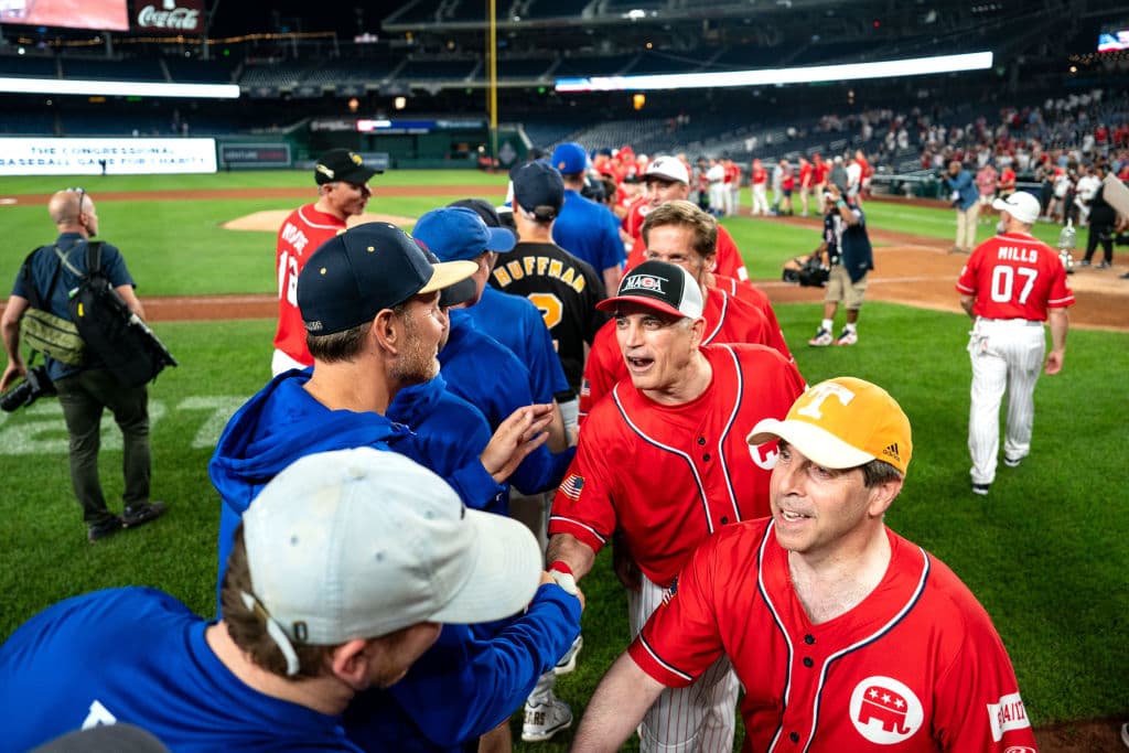 Kent Nishimura/Getty Images Members of the Democrat and Republican teams shake hands following the Congressional Baseball Game for Charity at National's Park on June 12.