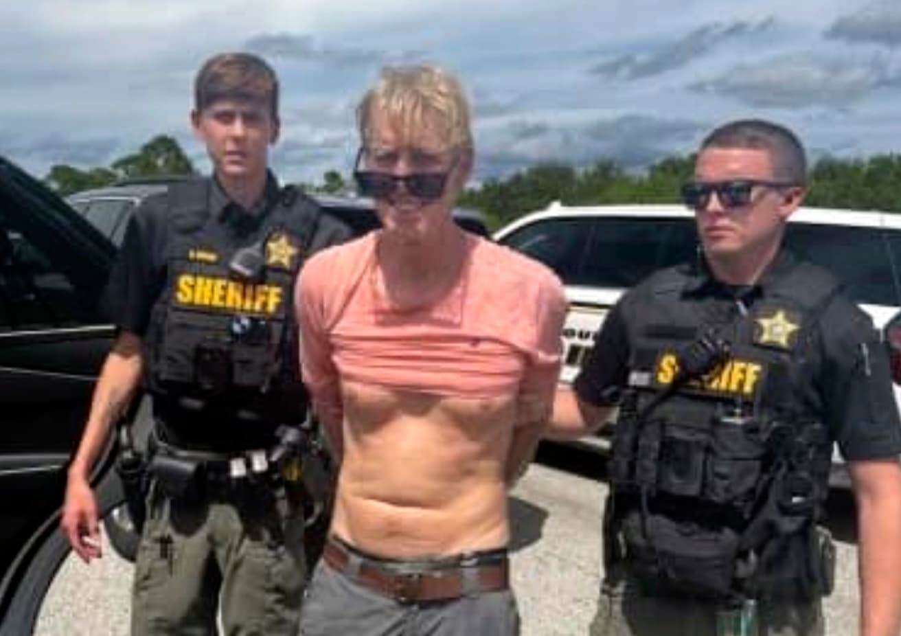 Martin County Sheriff's office via AP Law enforcement officers in Florida arrest Ryan Routh, the man suspected in the apparent assassination attempt of President Trump, September 15, 2024.