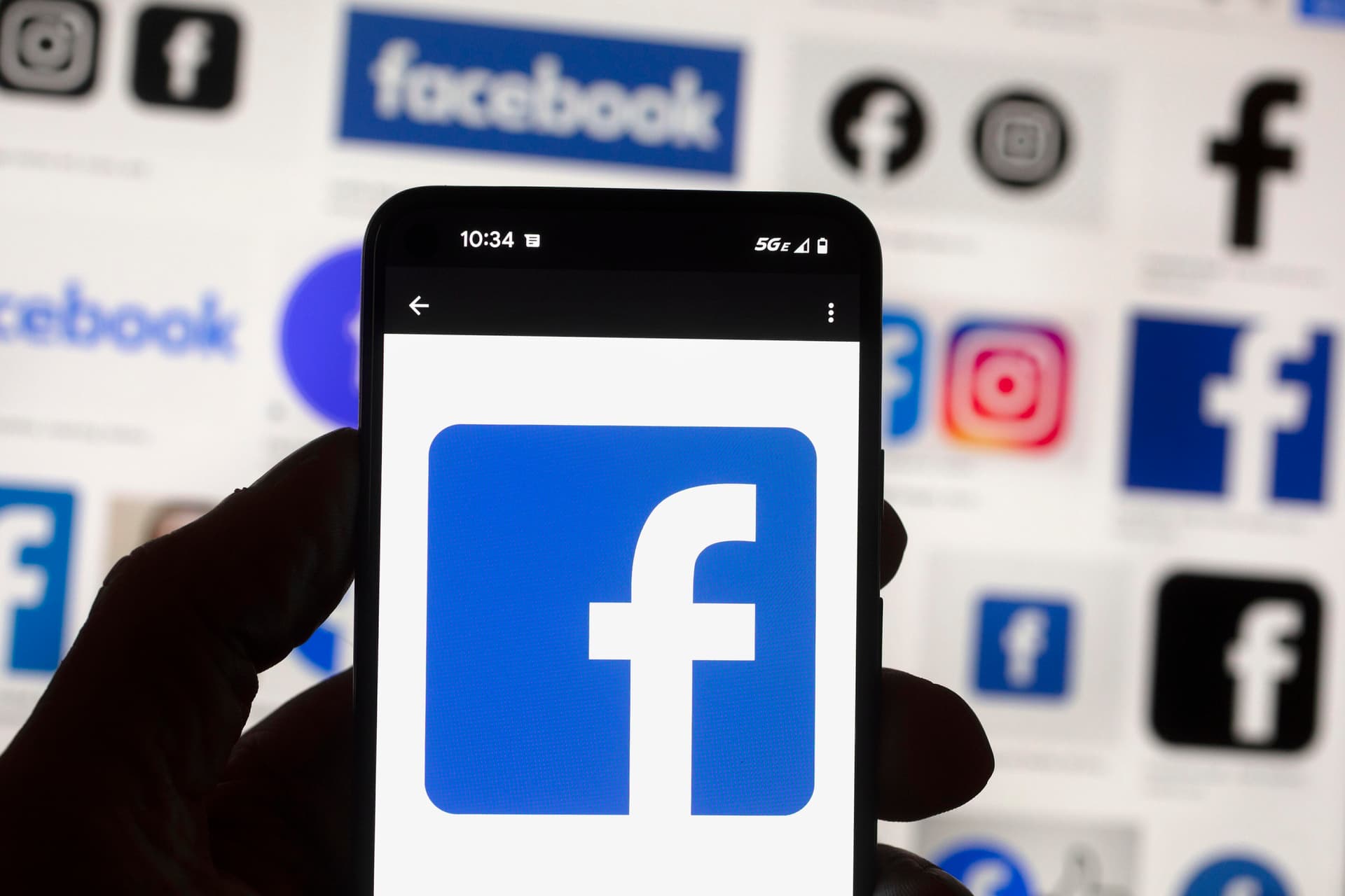 AP/Michael Dwyer The Facebook logo on a cell phone.