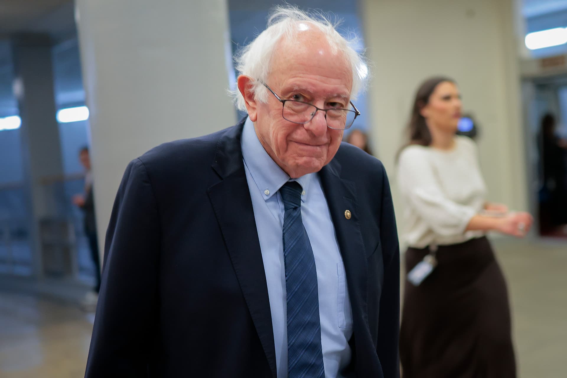 Heather Diehl/Getty Images Senator Bernie Sanders walks toward the Senate Chamber on December 11, 2025 at Washington, D.C.
