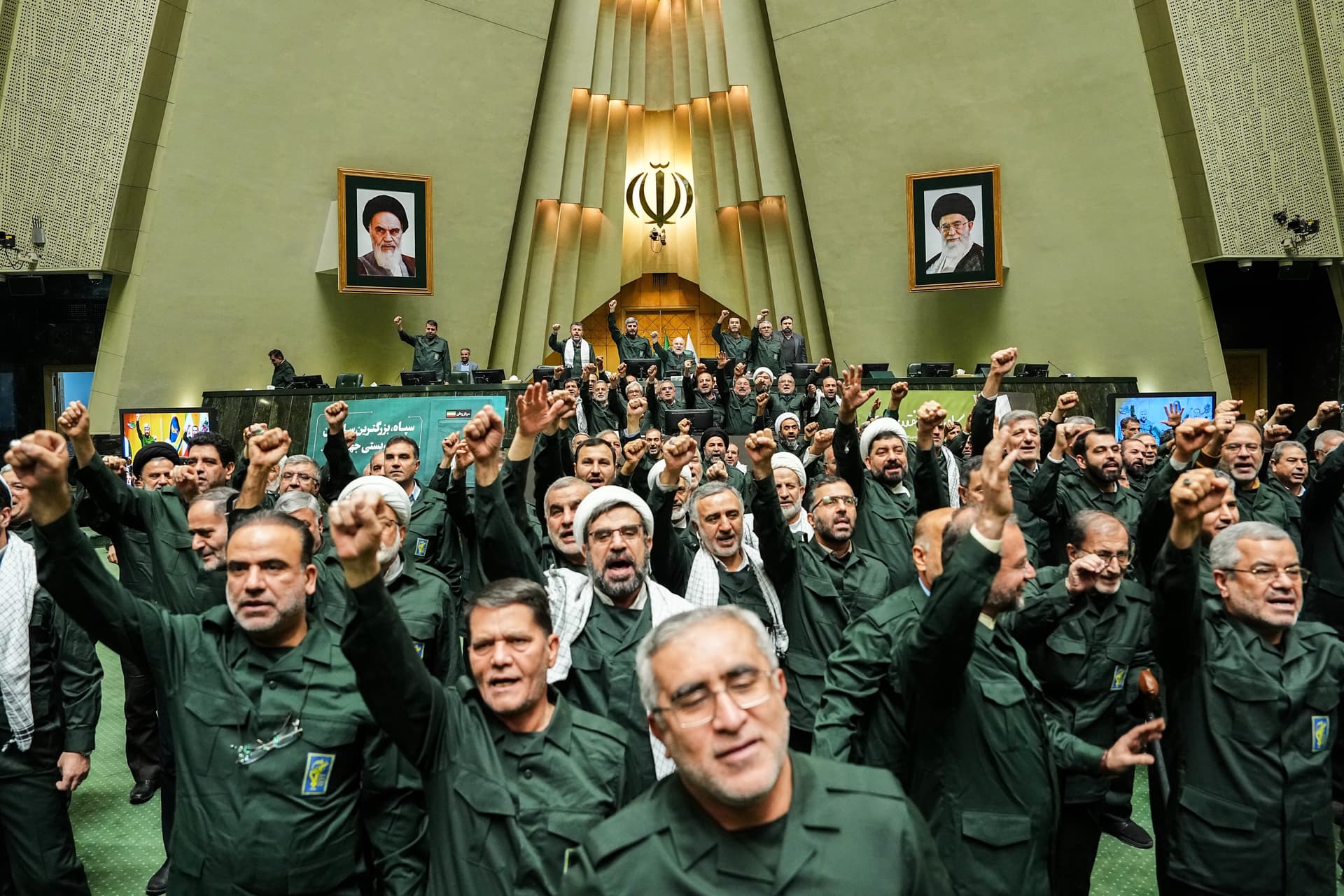 Hamed Malekpour/ICANA via AP In this handout photo released by the Islamic Consultative Assembly News Agency (ICANA) Iranian lawmakers chant slogans as they wear the Revolutionary Guard's uniform in a session of parliament, at Tehran, Iran, Feb. 1, 2026.