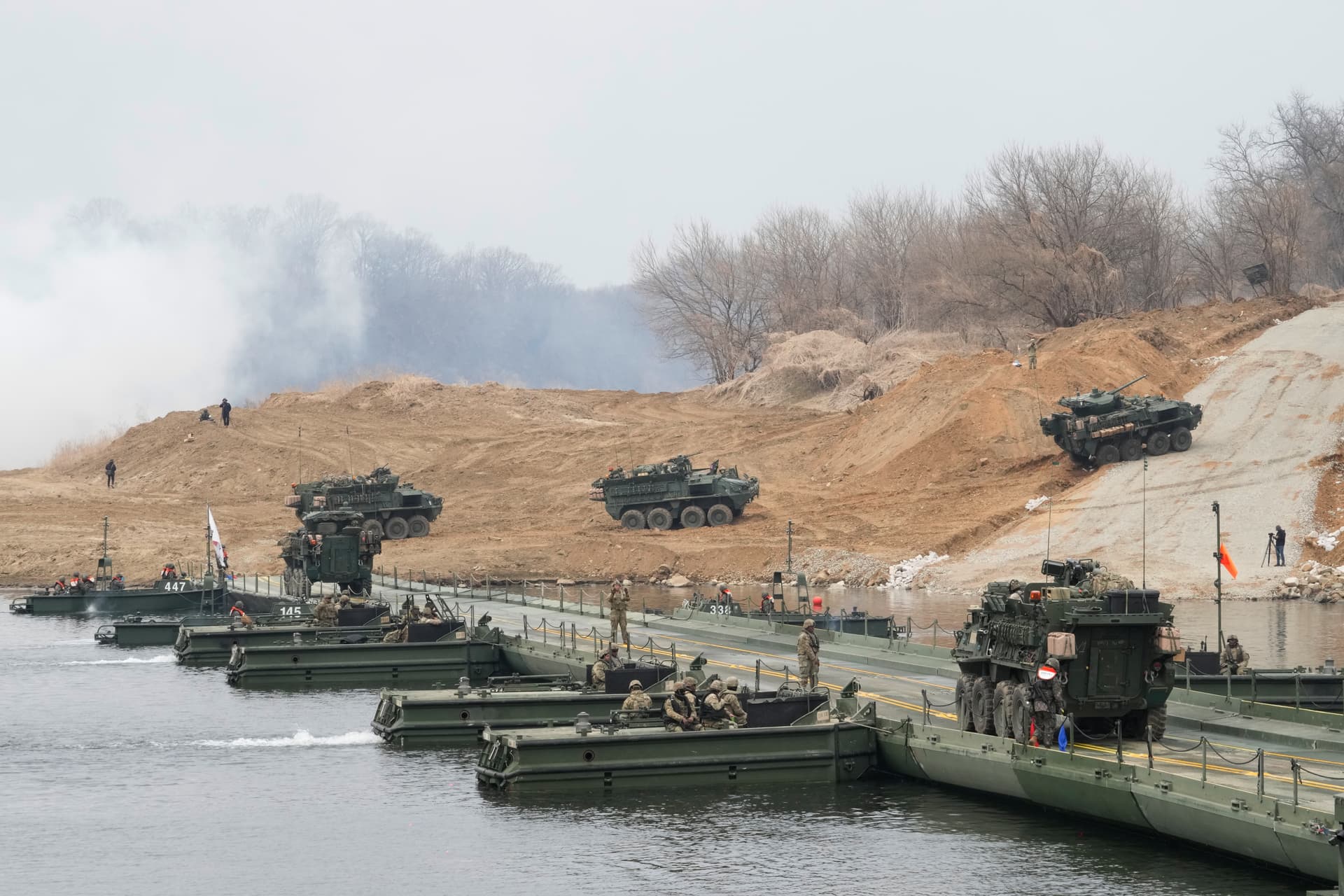 Ahn Young-joon/AP U.S. Army vehicles cross a floating bridge on the Imjin River during a joint exercise with South Korean forces at Yeoncheon, South Korea, on March 14, 2026.