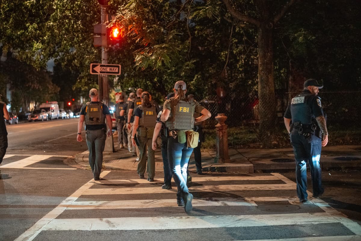 Andrew Leyden/Getty Images FBI agents walk on patrol in the U street neighborhood on August 13, 2025 in Washington, DC. President Trump announced plans to deploy federal officers and the National Guard to the District in order to place the DC Metropolitan Police Department under federal control and assist in crime prevention in the nation's capital.