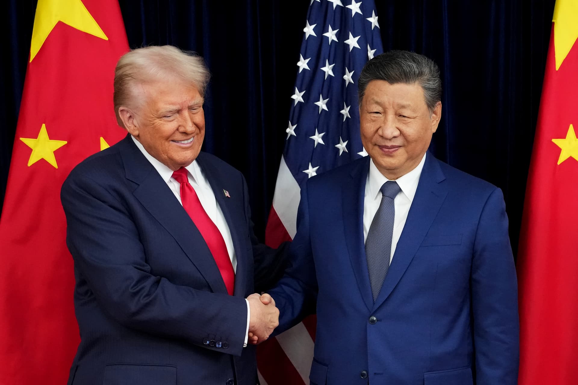 Andrew Harnik/Getty Images President Trump greets President Xi Jinping on October 30, 2025 at Busan, South Korea.