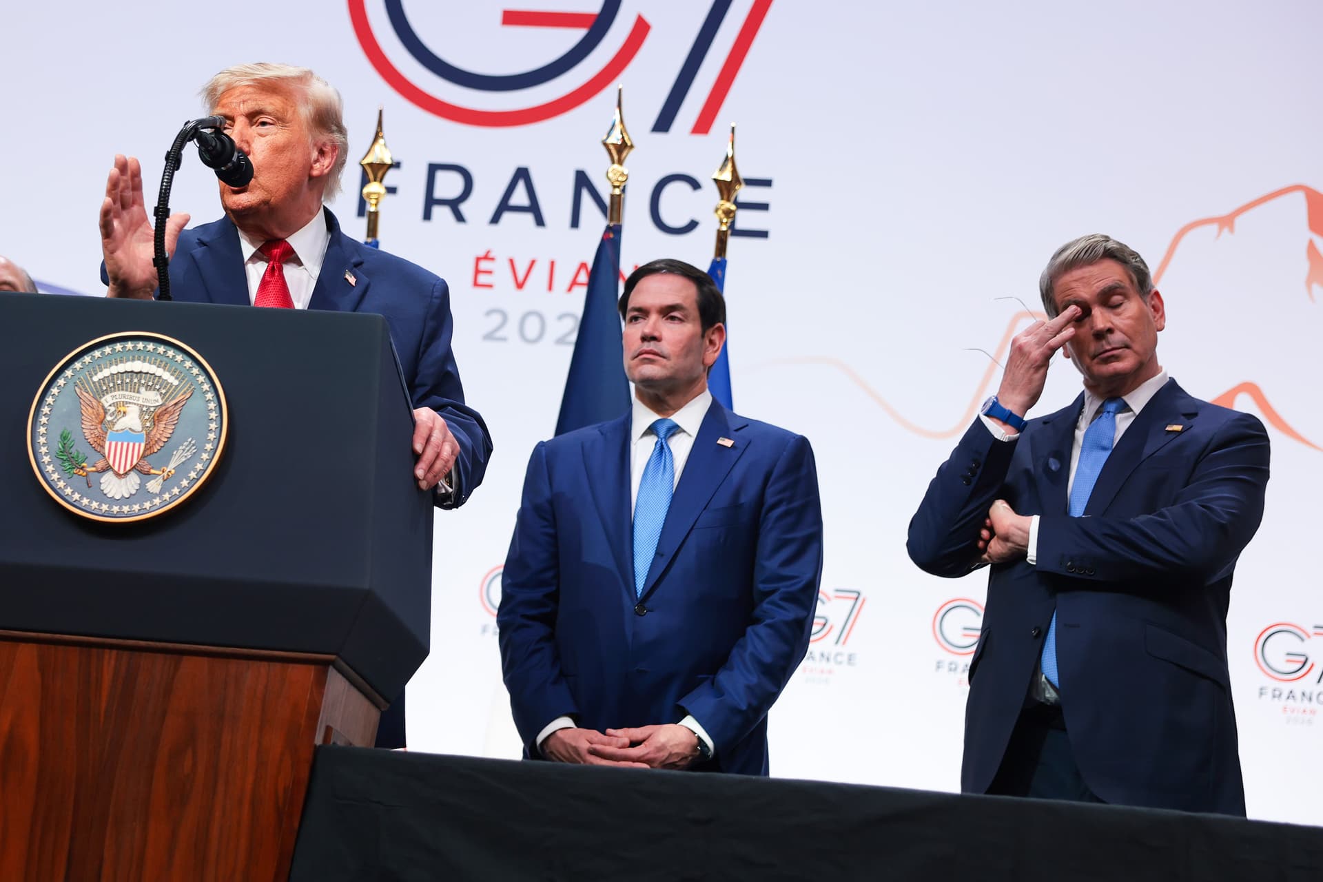 Anna Moneymaker/Getty Images Secretary of State Marco Rubio and U.S. Treasury Secretary Scott Bessent look on as President Trump speaks at a press conference during the G7 Leaders' Summit on June 17, 2026 at Evian-les-Bains, France.