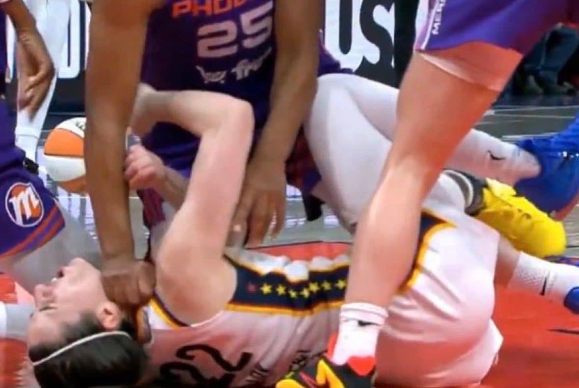 via x.com Alyssa Thomas pushes her fist into Caitlin Clark's neck.