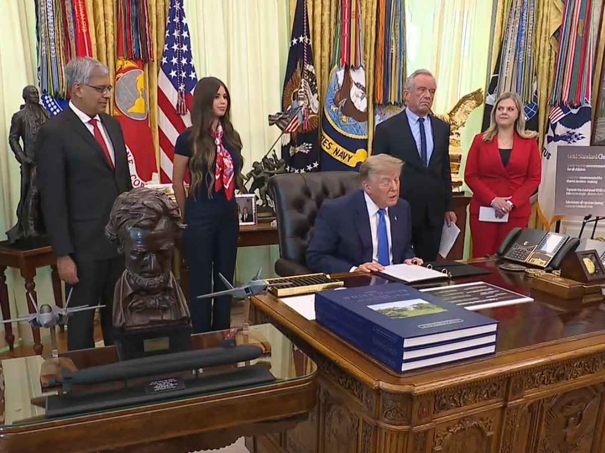 WhiteHouse.gov President Trump, joined by NIH Director Jay Battacharya and Health and Human Services Secretary Robert F. Kennedy Jr., signs an executive order changing the childhood vaccine schedule at an Oval Office announcement at the White House on August 10, 2026.
