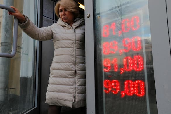 A screen outside a Moscow exchange office shows the currency exchange rates of the U.S. dollar and the euro to Russian rubles. AP/Alexander Zemlianichenko Jr., file