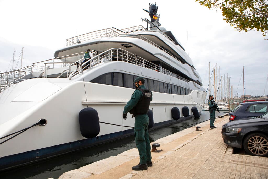 Civil Guards stand by the yacht called Tango at Palma de Mallorca, Spain, on Monday. The yacht is owned by a Russian oligarch. AP Photo/Francisco Ubilla, file