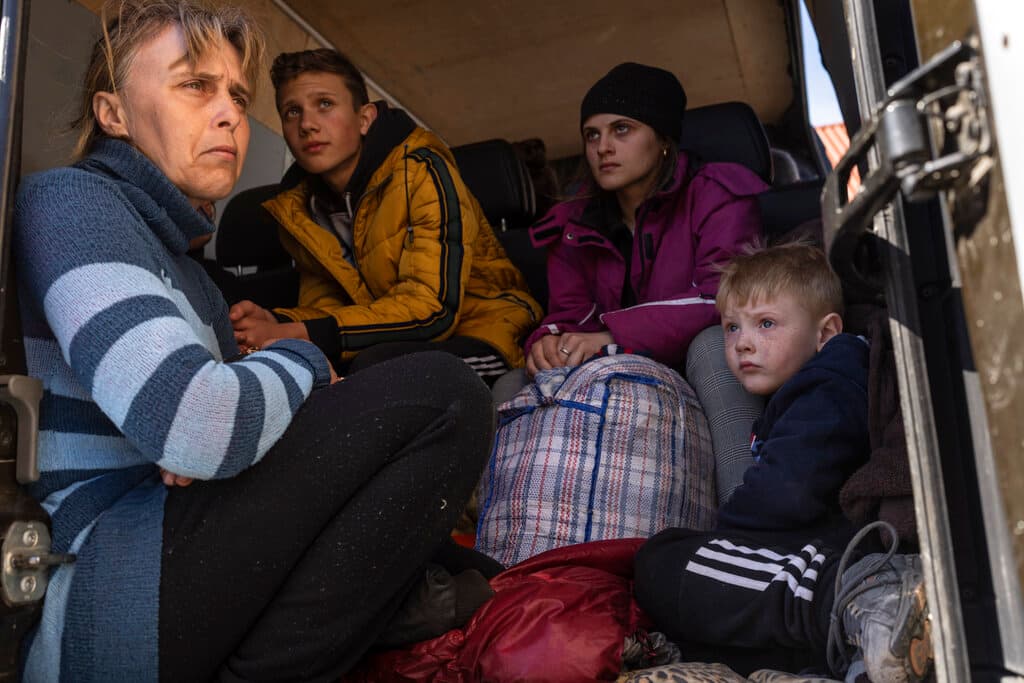 Civilians attempting to leave a village in Ukraine's Mikolaiv district on Thursday. AP Photo/Petros Giannakouris