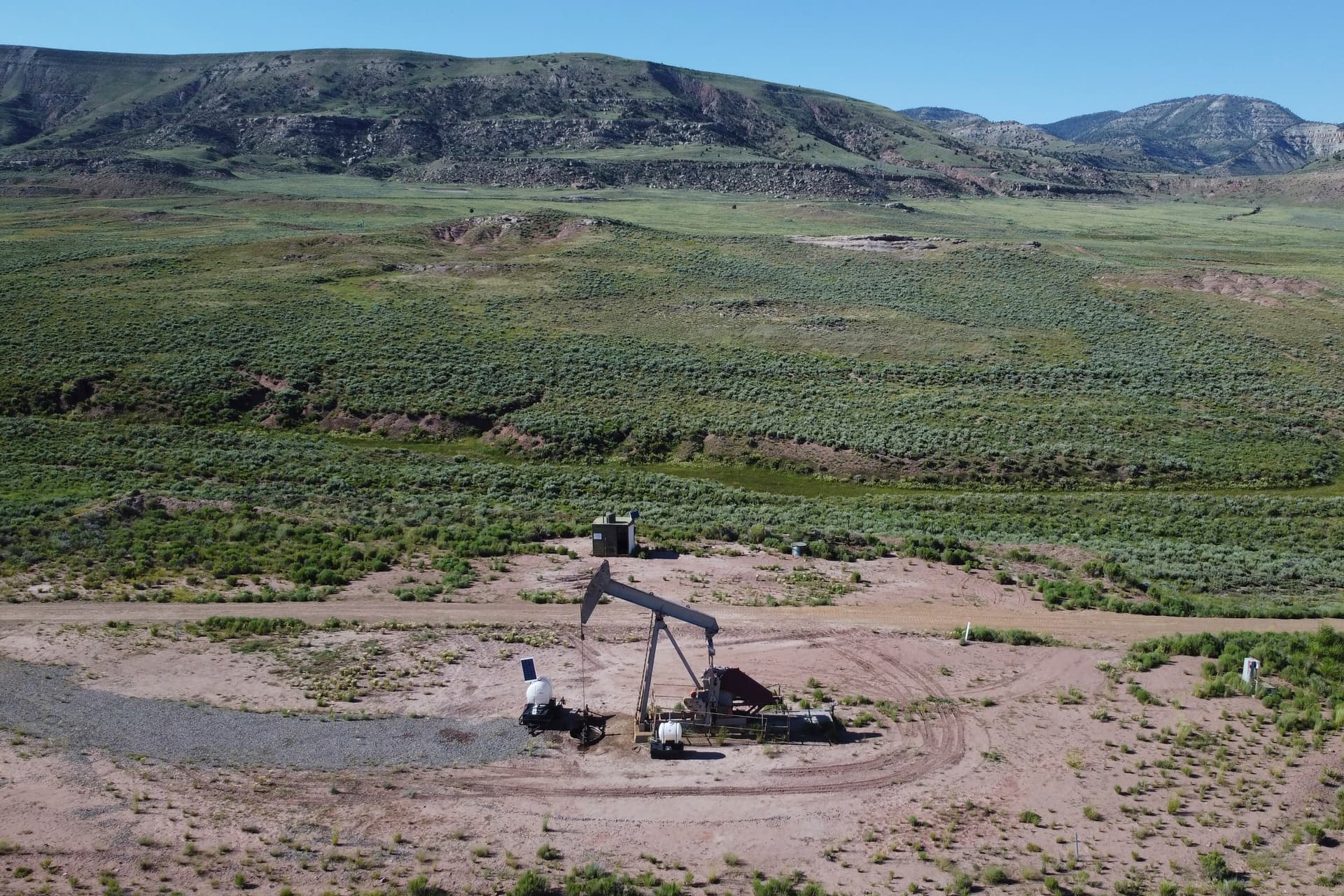 AP/Rick Bowmer A pumpjack dips its head to extract oil in a basin north of Helper, Utah.