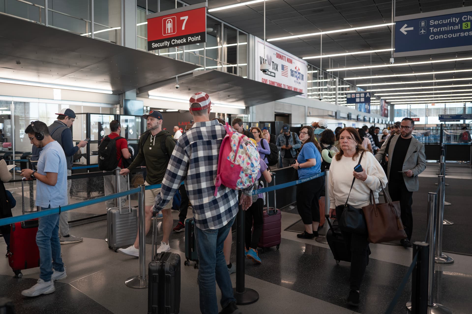 Scott Olson/Getty Images Passengers go through a security checkpoint at O'Hare International Airport.