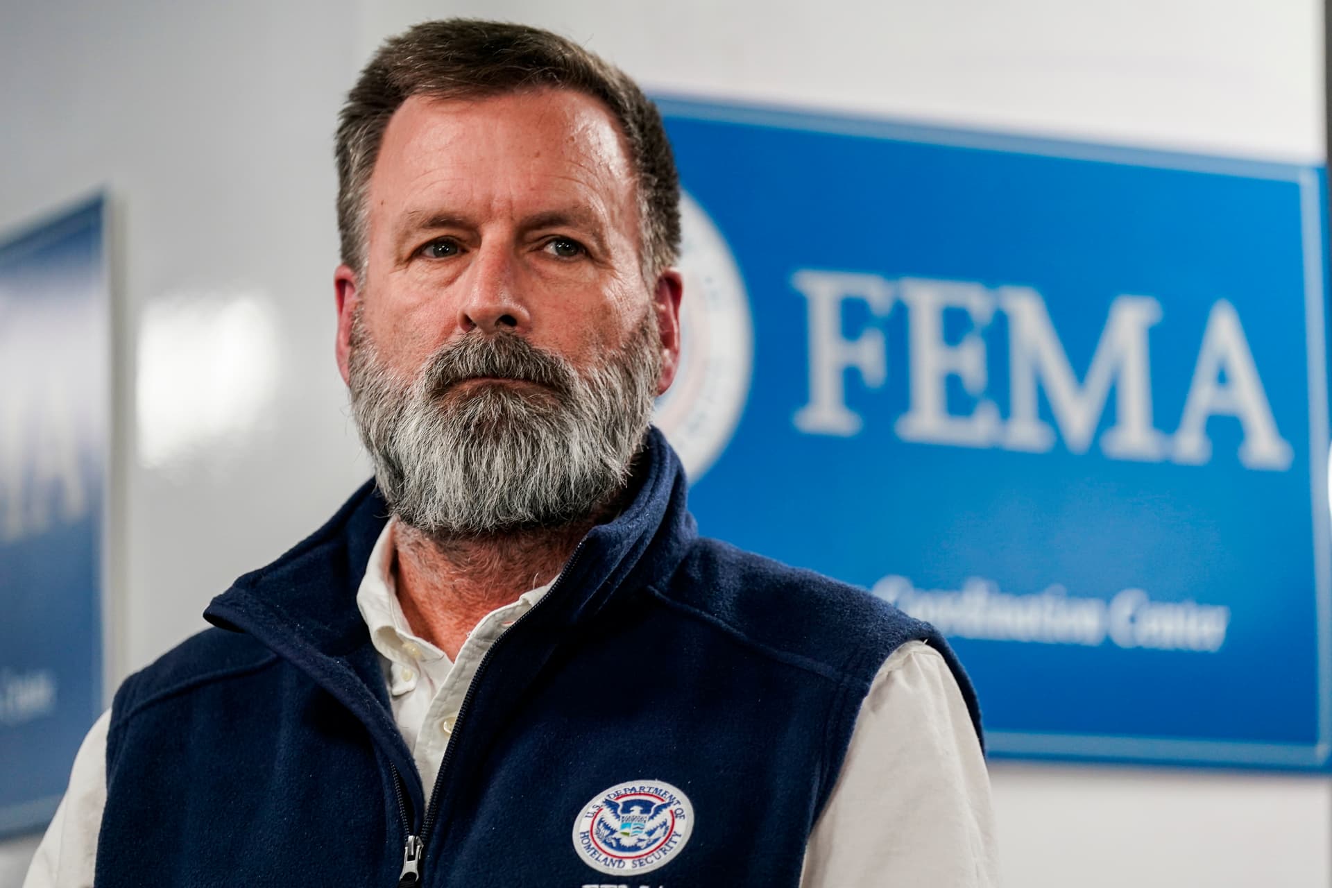 Al Drago/Getty Images The departing head of FEMA’s Office of Response and Recovery, Gregg Phillips, listens during a news conference at the Federal Emergency Management Agency headquarters at Washington, D.C., on January 24, 2026.