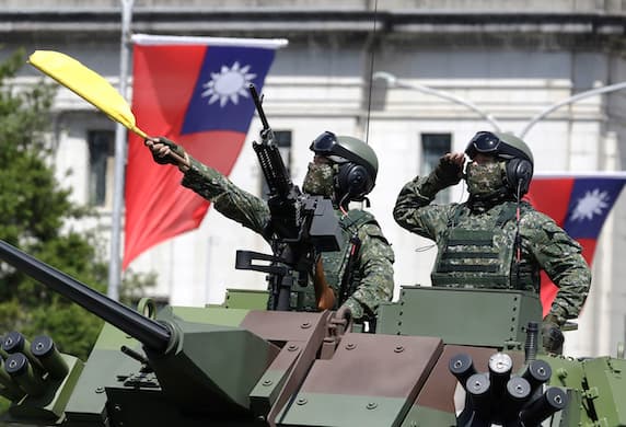AP/Chiang Ying-ying, file Free Chinese soldiers salute during National Day celebrations at Taipei, October 10, 2021.