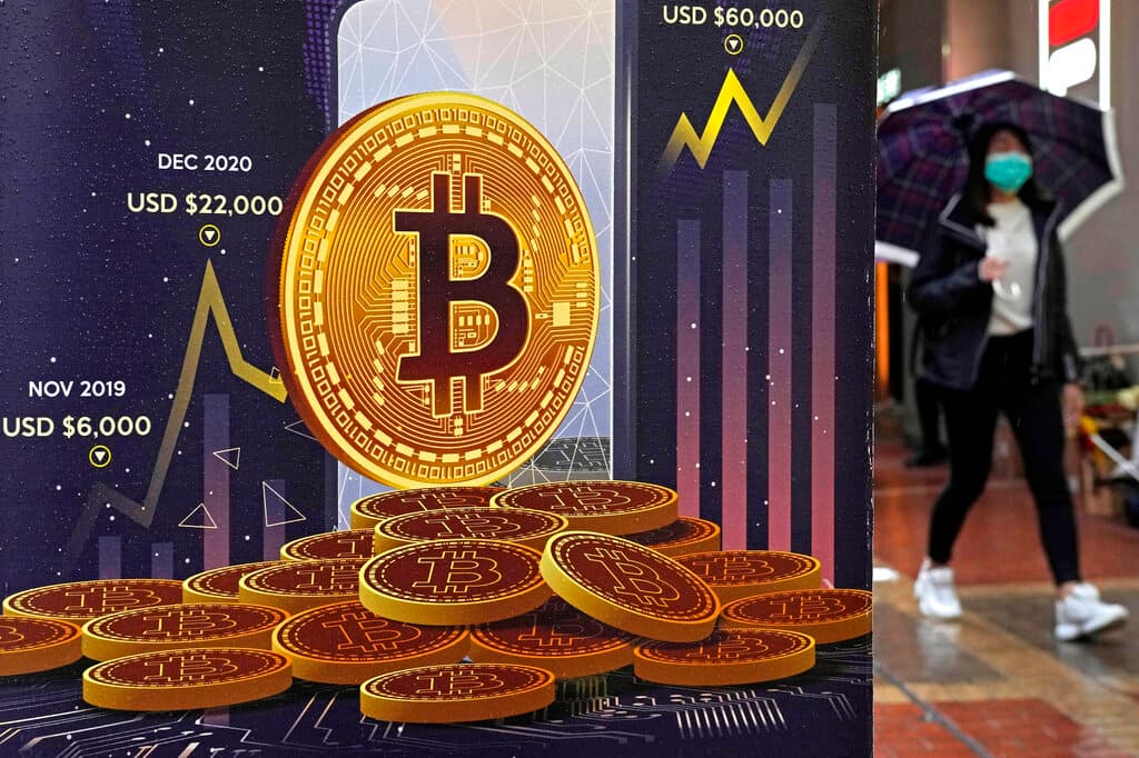 An advertisement for Bitcoin cryptocurrency. AP/Kin Cheung, file