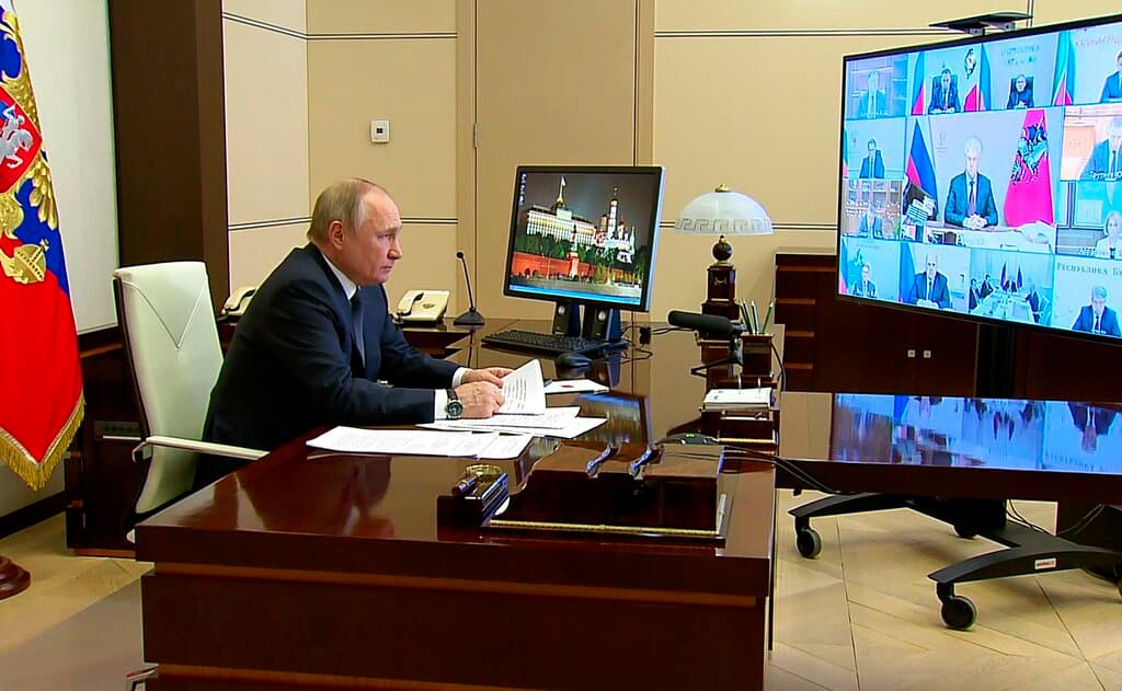 In a photo taken from video, President Putin is seen speaking via videoconference at the Novo-Ogaryovo residence outside Moscow March 16, 2022. Russian Presidential Press Service via AP, file