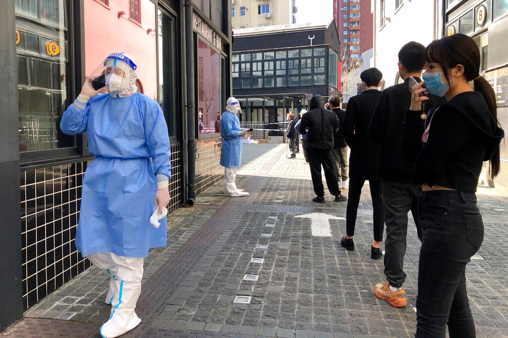 Residents line up for testing in a lockdown area in the Jingan district of western Shanghai, April 4, 2022. AP/Chen Si, file