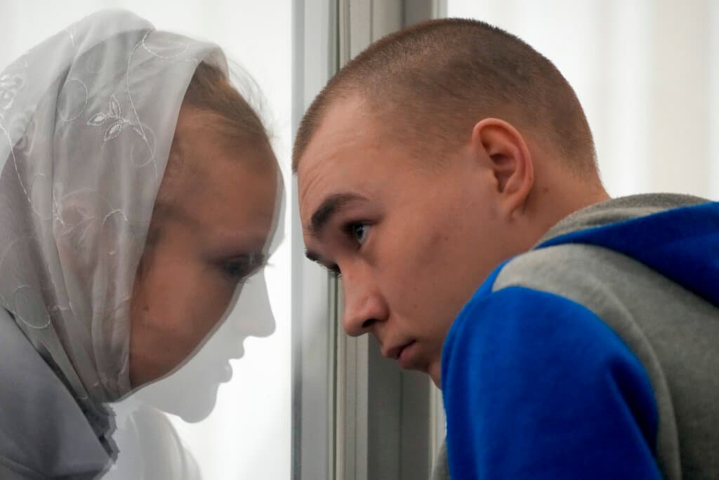 Sergeant Vadim Shishimarin listens to his translator during a court hearing at Kyiv May 23, 2022. AP/Natacha Pisarenko The New York Sun