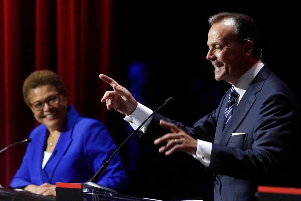 Genaro Molina/Los Angeles Times via AP, file Representative Karen Bass smiles at a point made by businessman Rick Caruso during a debate on March 22, 2022, at Los Angeles.