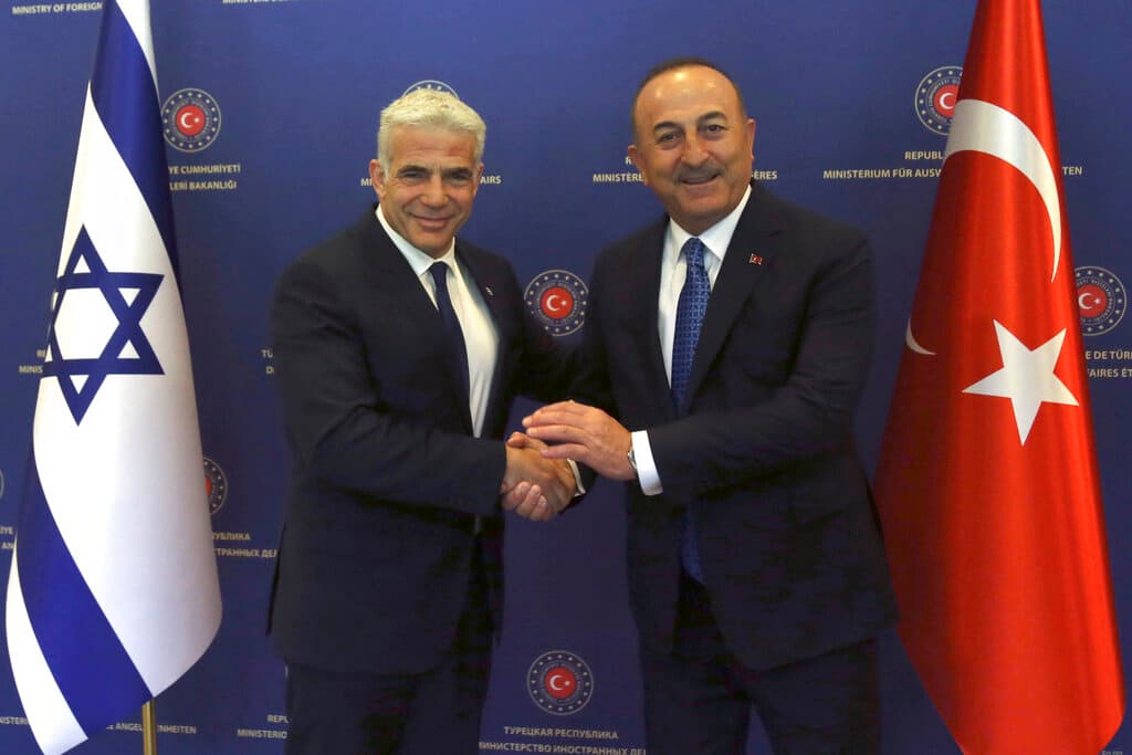 Necati Savas, pool via AP The Israeli and Turkish foreign ministers, Yair Lapid and Mevlut Cavusoglu, at Ankara June 23, 2022.