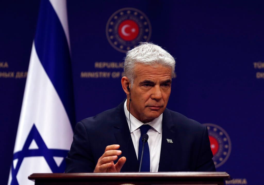 AP/Burhan Ozbilici The Israeli foreign minister, Yair Lapid, during a joint news conference with the Turkish foreign minister, Mevlut Cavusoglu, at Ankara, June 23, 2022.