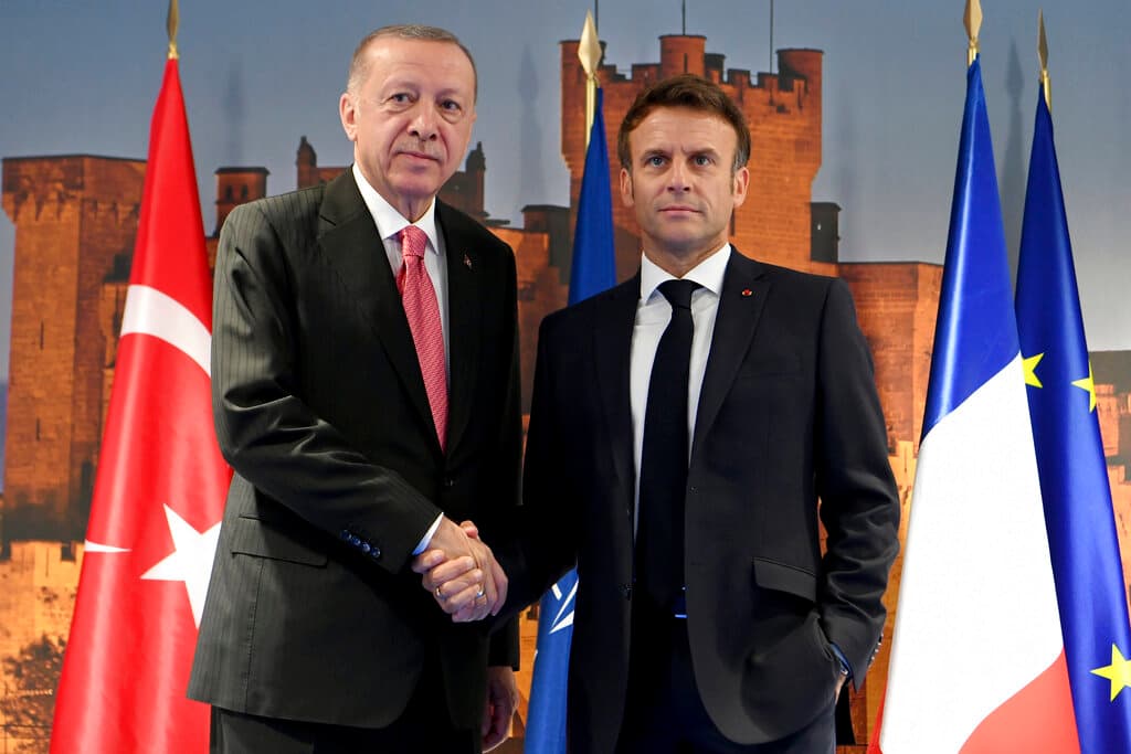 Bertrand Guay, pool via AP Turkey's president, Recep Tayyip Erdogan, with President Macron at the NATO summit June 29, 2022.