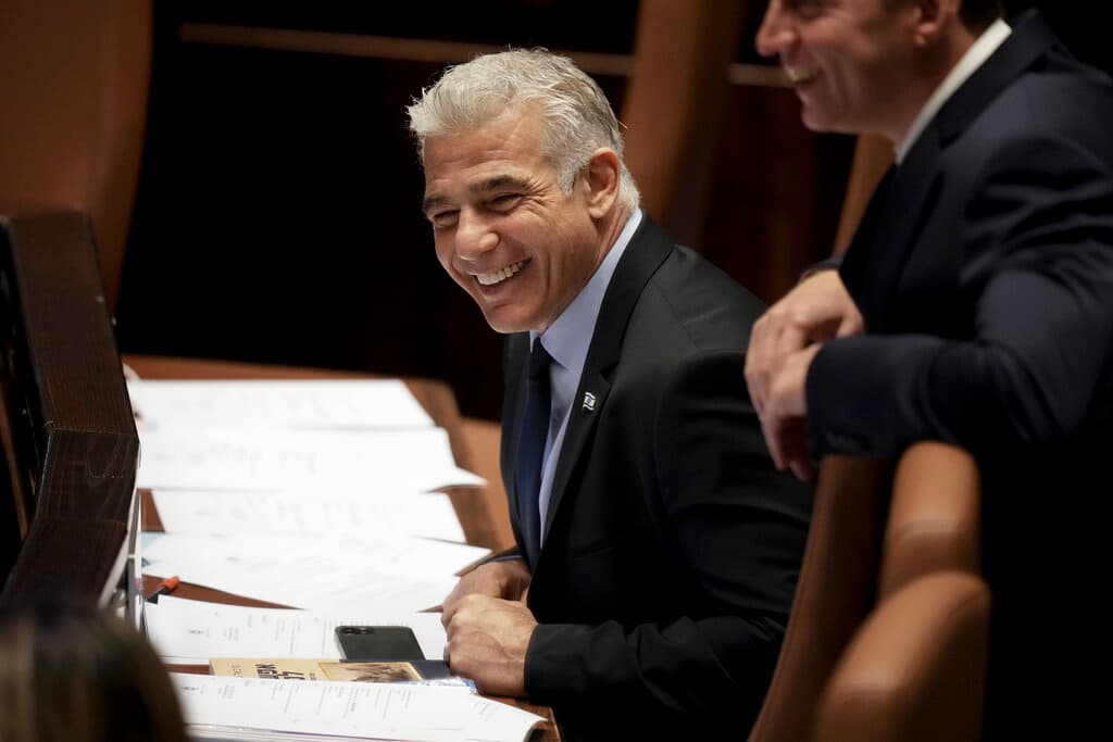 APAriel Schalit Yair Lapid at the Knesset June 30, 2022.