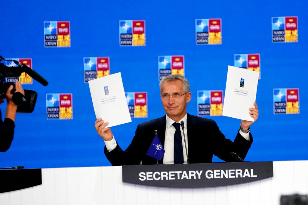 AP/Paul White NATO’s secretary-general, Jens Stoltenberg, holds up a letter of commitment to innovation at a NATO summit at Madrid, June 30, 2022.