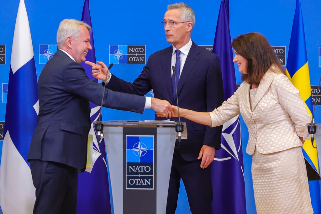 AP/Olivier Matthys Finland's foreign minister, Pekka Haavisto, left, Sweden's foreign minister Ann Linde, right, and Secretary General Jens Stoltenberg at NATO headquarters, July 5, 2022.