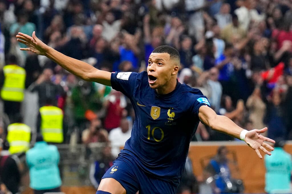 AP/Natacha Pisarenko France's Kylian Mbappe celebrates scoring from the penalty spot his side's third goal during the World Cup final soccer match between Argentina and France at Qatar, December 18, 2022.