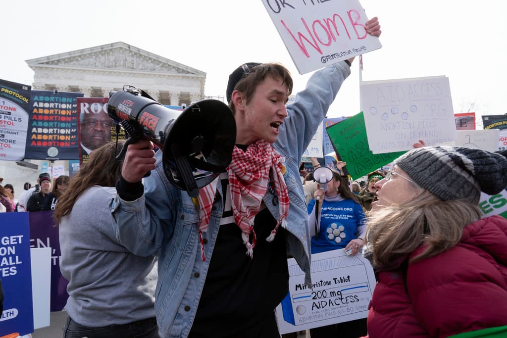 AP/Jose Luis Magana Anti-abortion and abortion-rights activists rally outside the Supreme Court, March 26, 2024, at Washington.