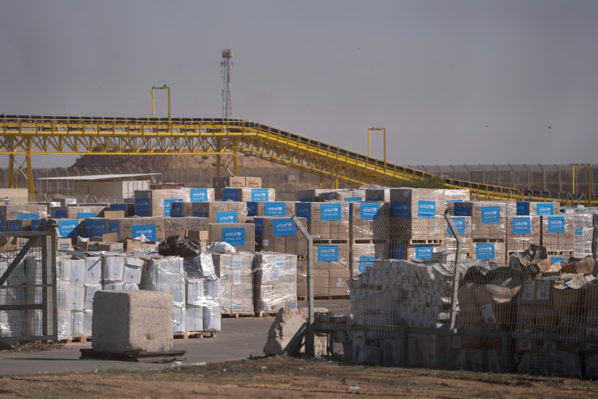 AP/Ohad Zwigenberg Humanitarian aid waiting to be picked up on the Palestinian side of the Kerem Shalom aid crossing at the Gaza Strip, December 2024.