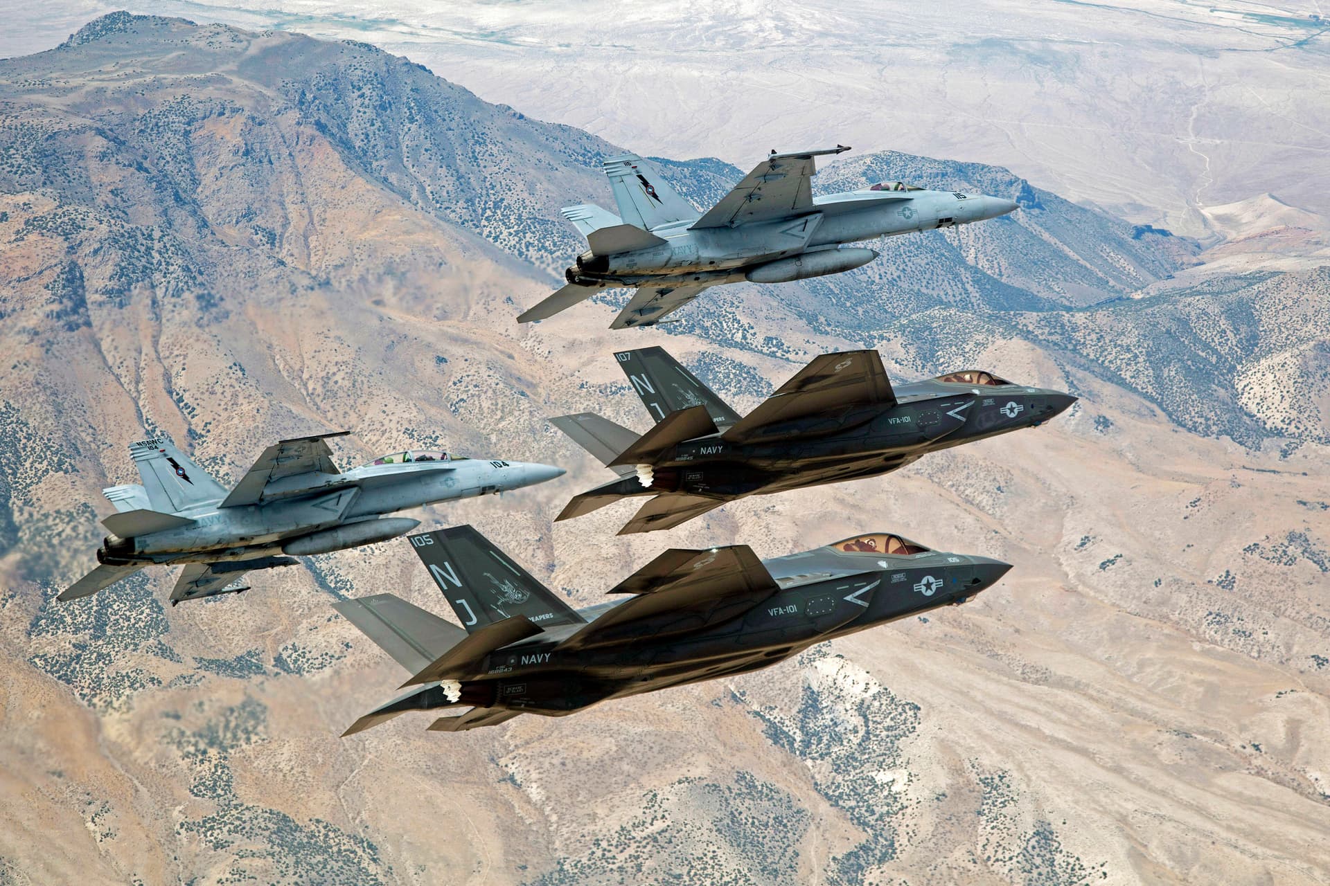 United States Navy via AP F-35C Lightning IIs and F/A-18E/F Super Hornets fly over Naval Air Station Fallon's Range Training Complex near Fallon, Nevada.