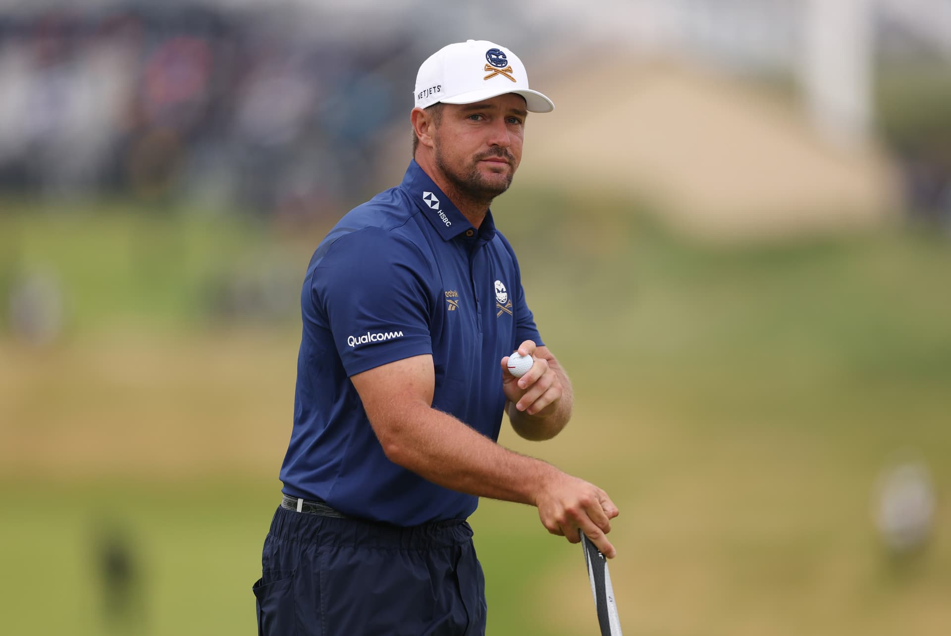 Andrew Redington/Getty Images Bryson DeChambeau acknowledges the crowd on the first green during day one of the 153rd Open Championship at Royal Portrush Golf Club on July 17, 2025, at Portrush, Northern Ireland.