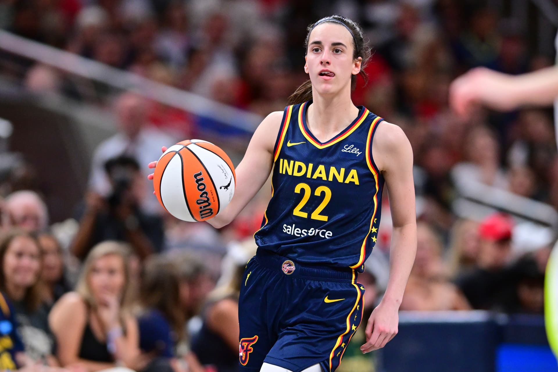 AP Photo/Doug McSchooler Indiana Fever's Caitlin Clark dribbles during the second half of a WNBA basketball game against the Dallas Wings on Sunday, July 13, 2025, in Indianapolis.