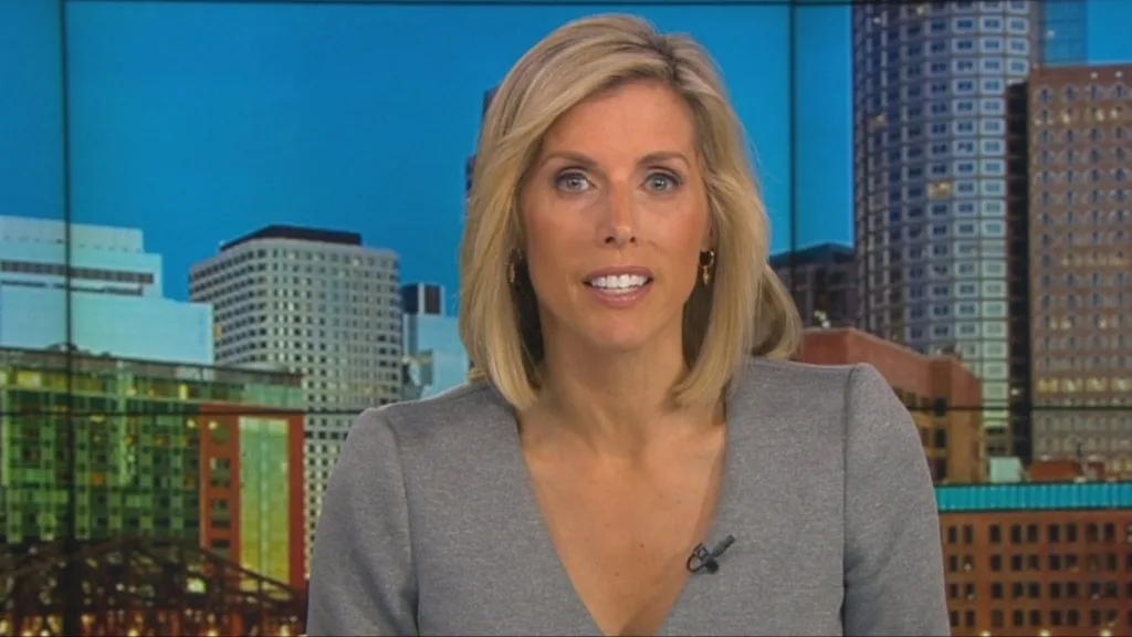 WBZ Kate Merrill is shown anchoring the news on WBZ-TV. She claims she was constructively discharged after being discriminated against for being white.
