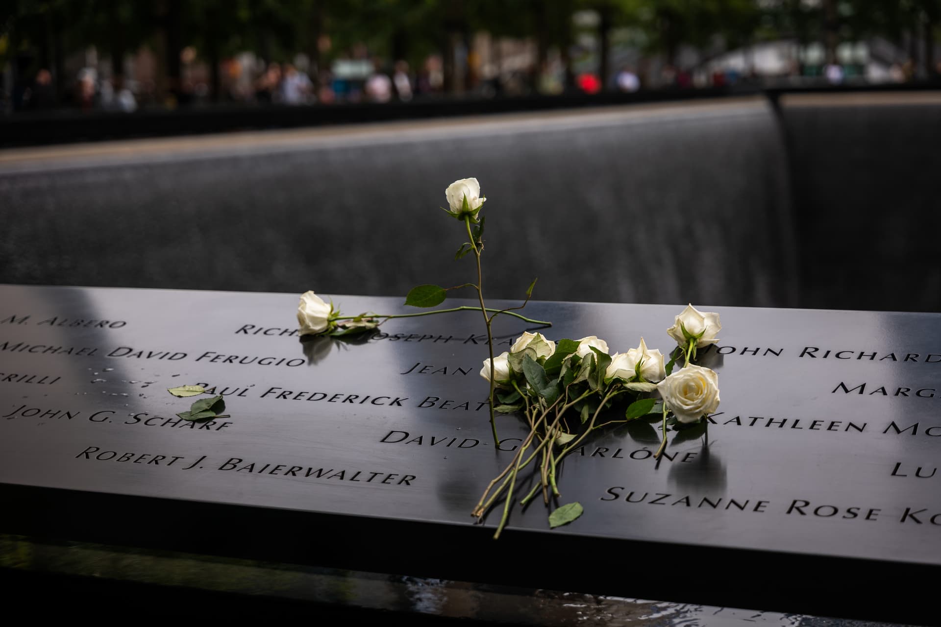 Spencer Platt/Getty Images Flowers are placed on victims' names at the National September 11 Memorial & Museum on September 10, 2025, at New York City.