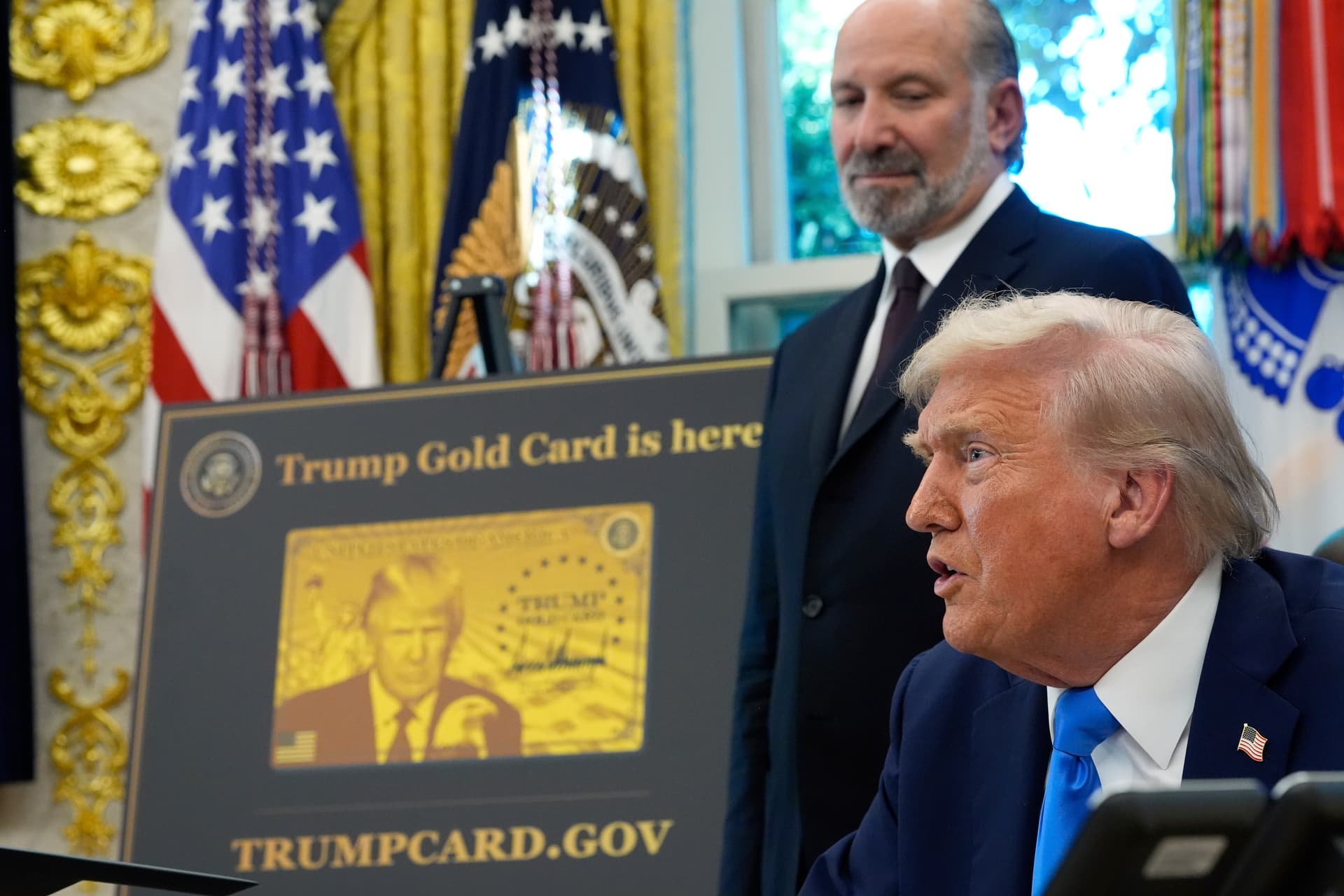 Alex Brandon/AP Commerce Secretary Howard Lutnick looks on as President Trump announces new visa policies in the Oval Office on September 19, 2025.