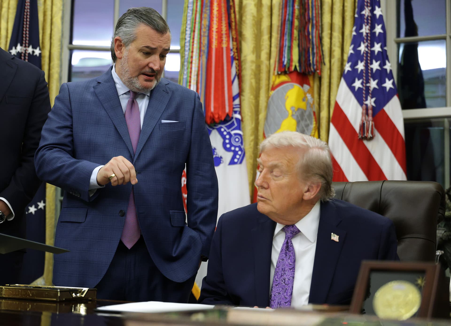 Alex Wong/Getty Images Senator Ted Cruz and President Trump talk in the Oval Office of the White House on December 11, 2025.