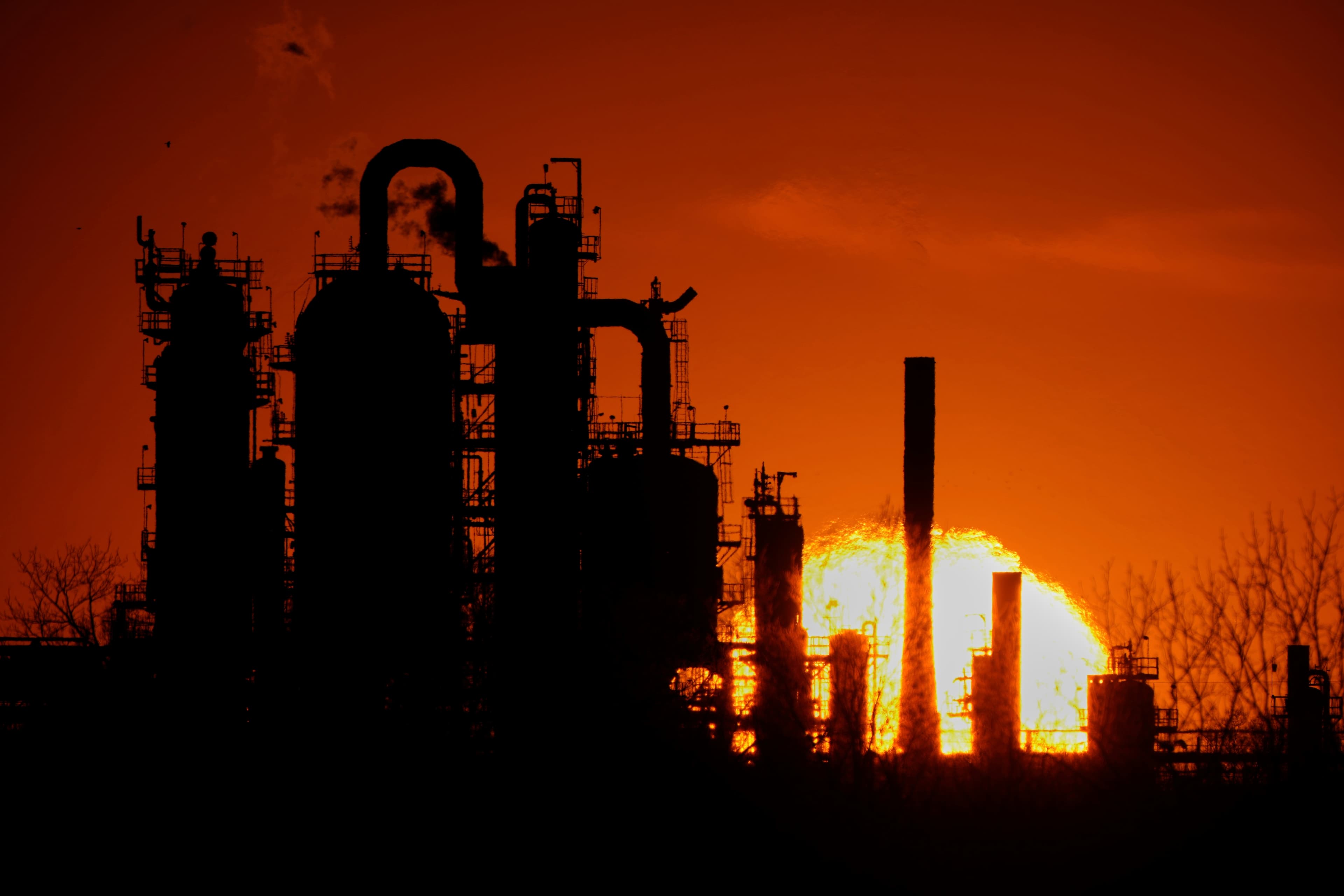 The HF Sinclair El Dorado oil refinery is silhouetted against the sky at sunset, March 21, 2025. The HF Sinclair El Dorado oil refinery is silhouetted against the sky at sunset, March 21, 2025.