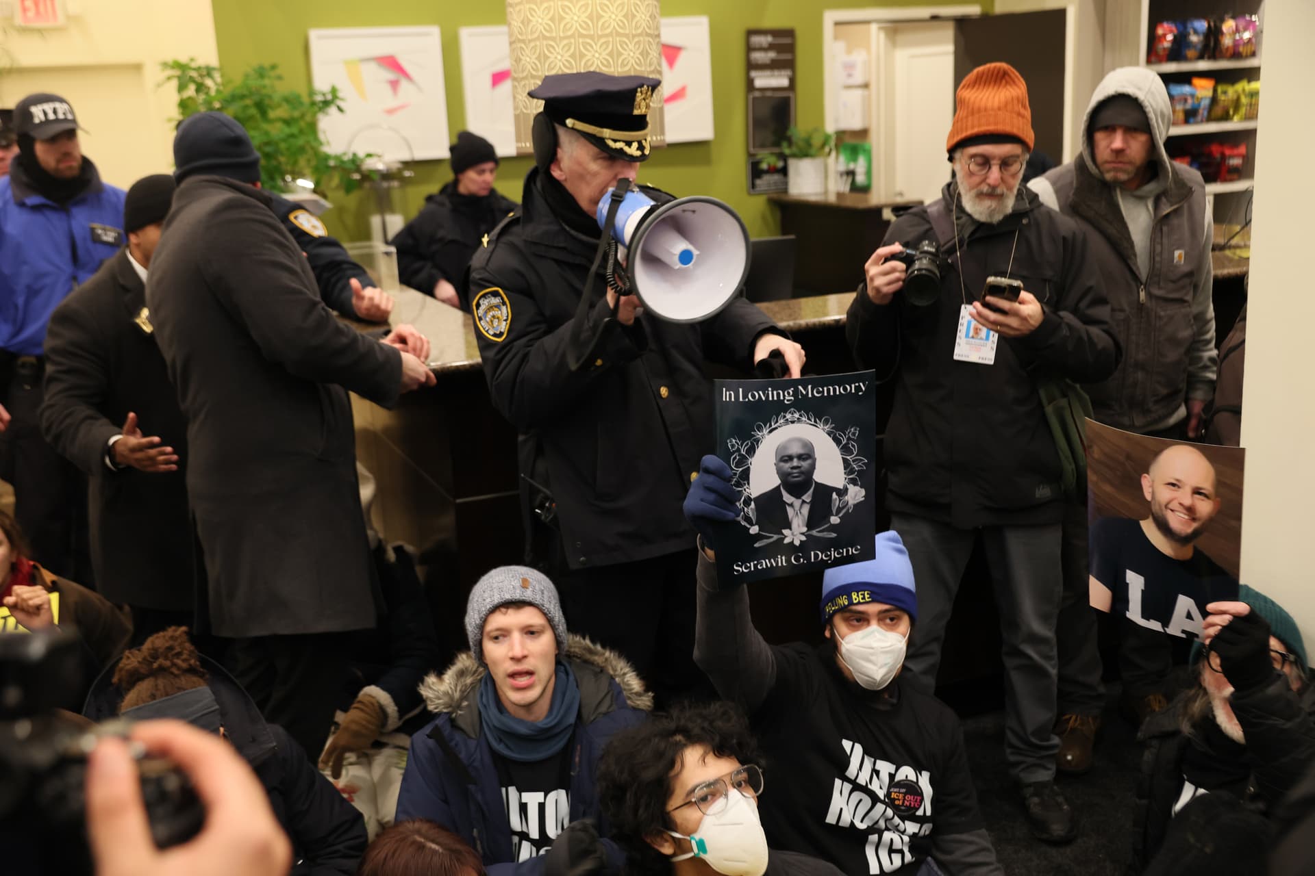 Michael M. Santiago/Getty Images NYPD gives an order to leave or be arrested as immigration rights activists stage a sit-in at the Hilton Garden Inn on January 27, 2026. Various human rights organizations and immigration rights activists took over the lobby of the hotel where Immigration and Customs Enforcement (ICE) agents are reportedly staying.