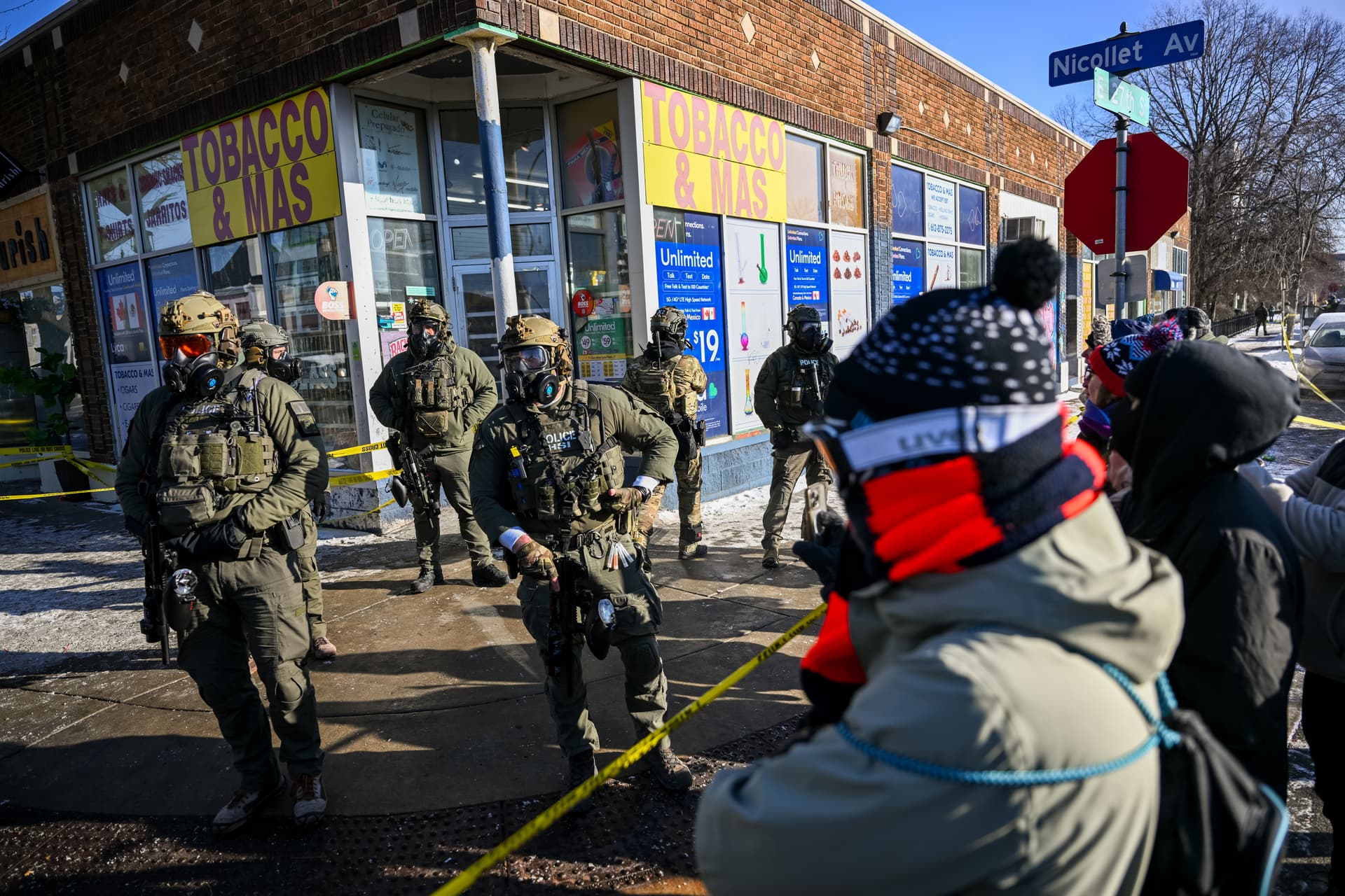 Brandon Bell/Getty Images Onlookers gather after federal agents shot a protester at Minneapolis on January 24, 2026.