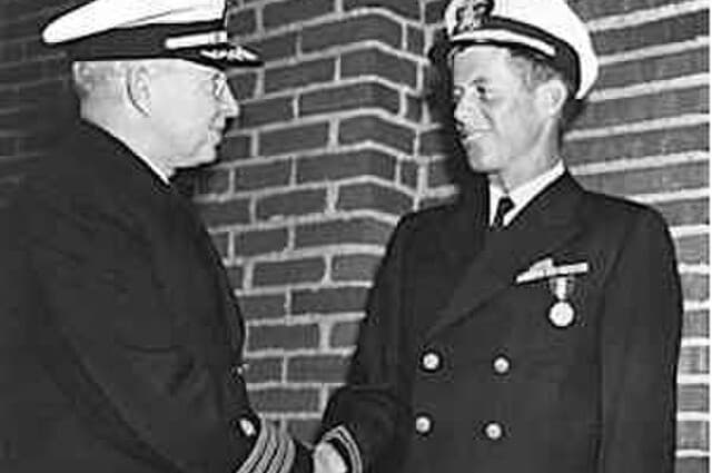 The John F. Kennedy Presidential Library and Museum via Wikimedia Commons Lieutenant John F. Kennedy receives the Navy and Marine Corps medal for his role in the rescue of the crew of PT 109 on August 2, 1943.