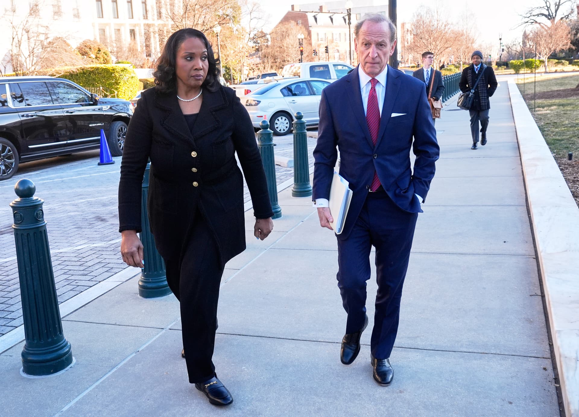 AP/Mark Schiefelbein Federal Reserve Governor Lisa Cook and her attorney, Abbe Lowell, arrive at the Supreme Court at Washington, D.C., on Jan. 21, 2026.