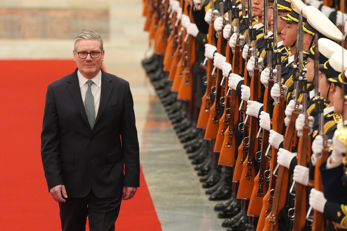 Carl Court/Getty Images British Prime Minister Keir Starmer attends a ceremonial welcome ahead of his meeting with with Li Qiang, Premier of the People's Republic of China, at the Great Hall of The People.