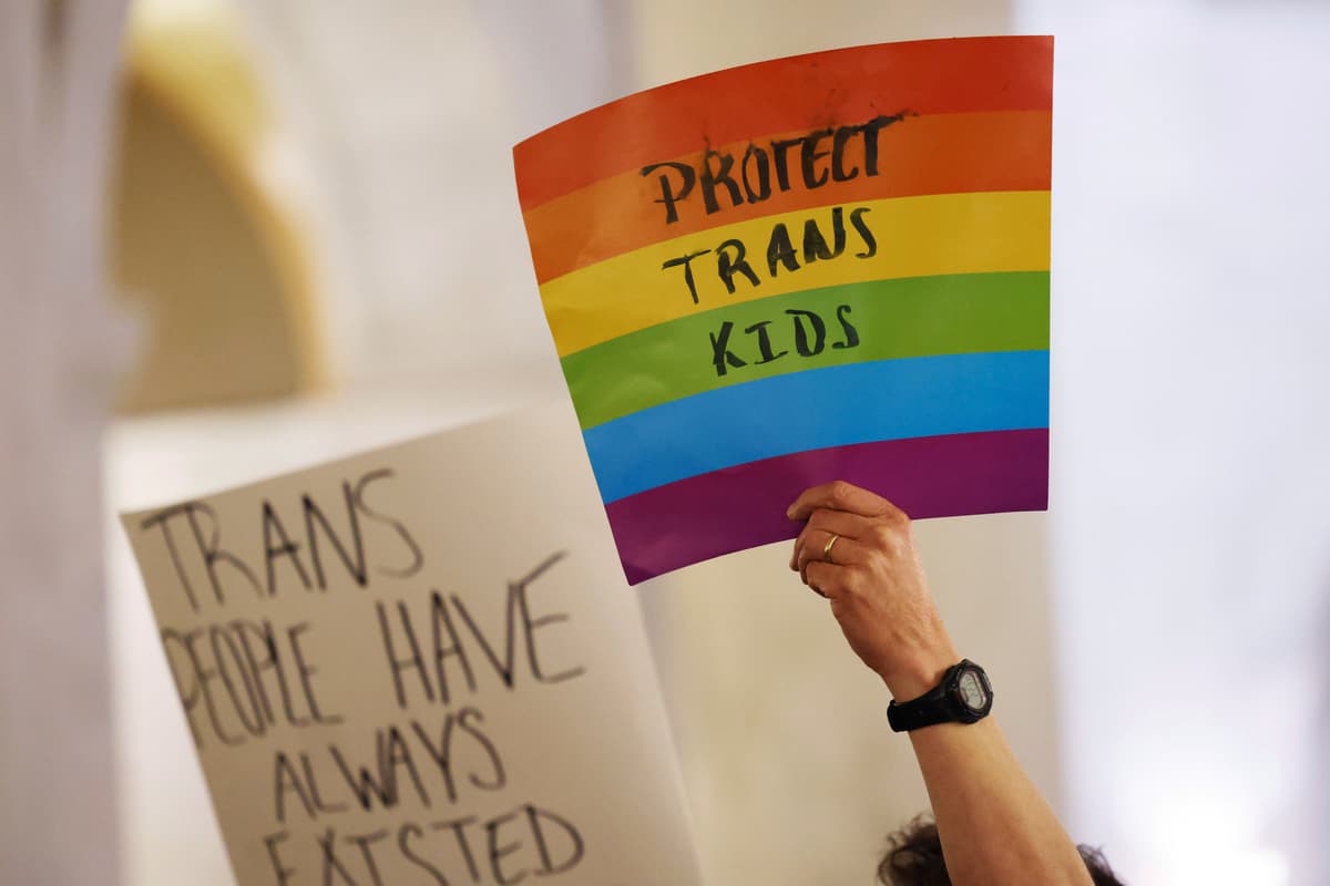 AP Photo/Chris Jackson Protestors hold signs during a rally at the state capitol at Charleston, West Virginia, on March 9, 2023.