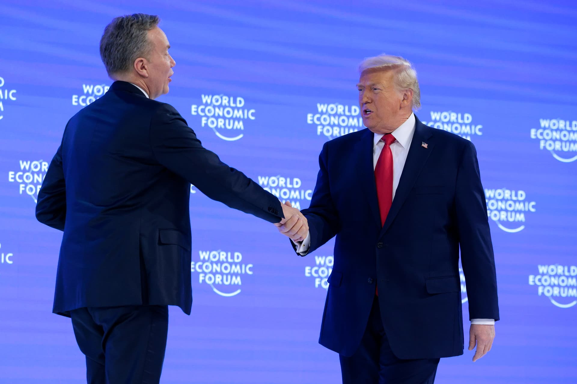 Chip Somodevilla/Getty Images President Trump is greeted onstage by CEO of the World Economic Forum Børge Brende before giving a speech at the World Economic Forum (WEF) on January 21, 2026 at Davos, Switzerland.