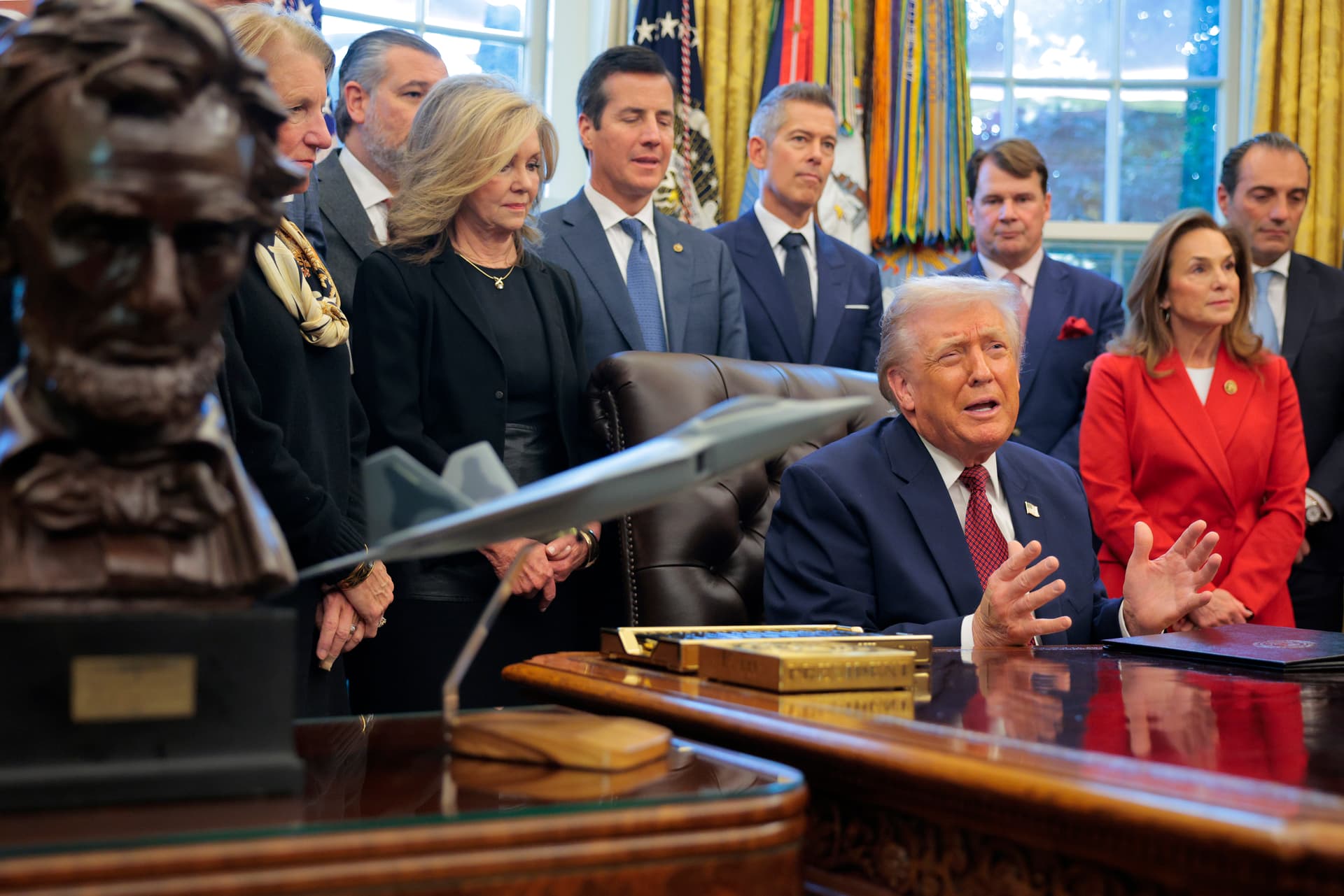 Chip Somodevilla/Getty Images President Donald Trump, joined by executives from major automobile makers, announces an easing of the country's fuel economy standards at the White House on December 3, 2025.