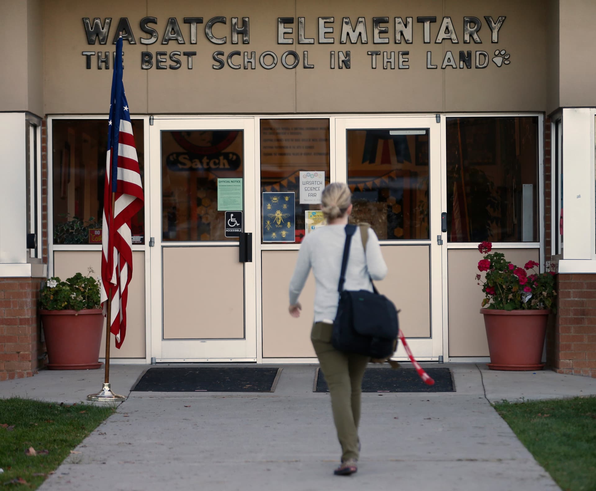George Frey/Getty Images A woman enters Wasatch Elementary school in Utah.