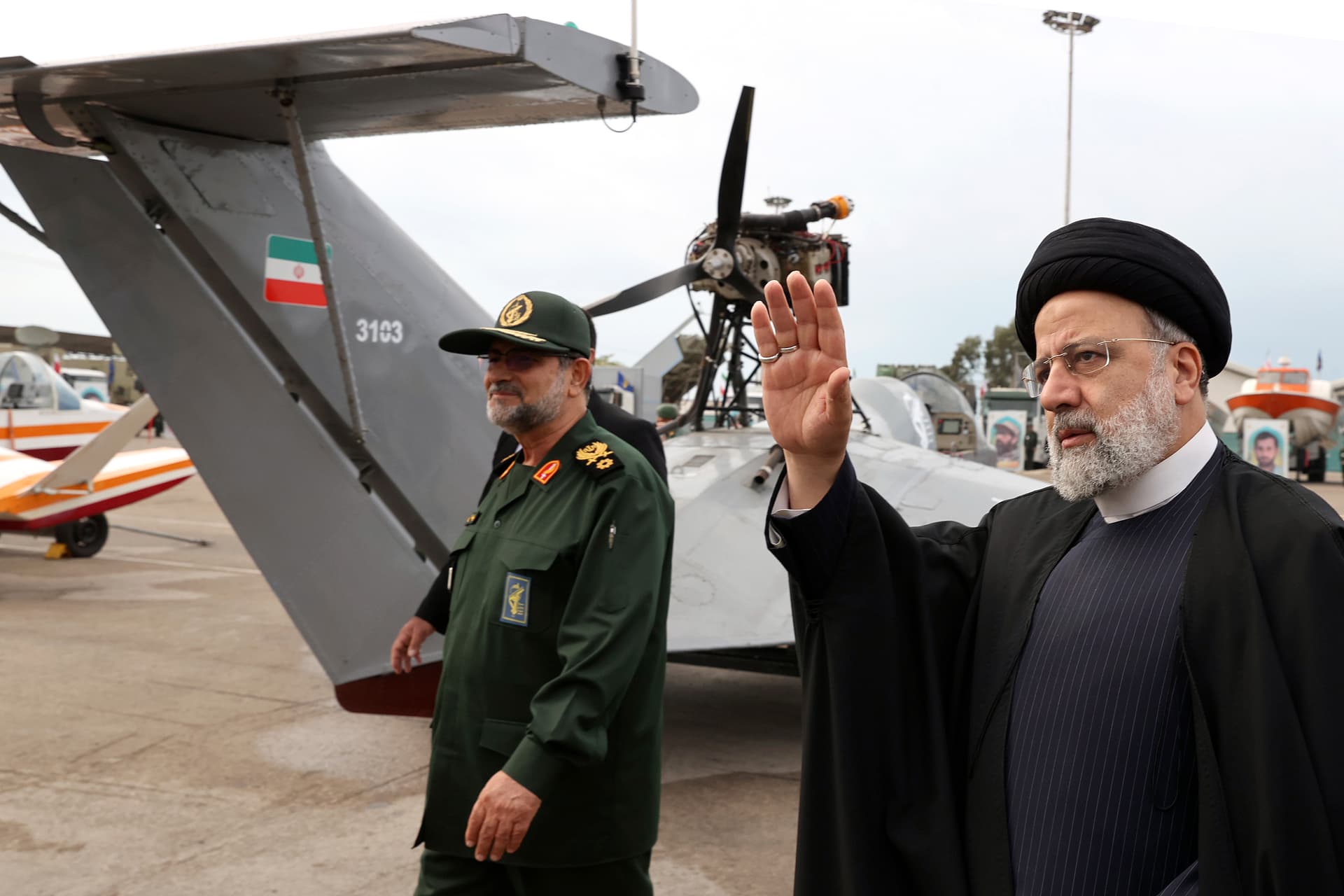 Iranian Presidency Office via AP In this photo released by the Iranian Presidency Office, President Ebrahim Raisi waves as he visits an exhibition of the Revolutionary Guard navy capabilities while accompanied by the guard's navy commander Alireza Tangsiri, in the southern port city of Bandar Abbas, Iran, February 2, 2024.